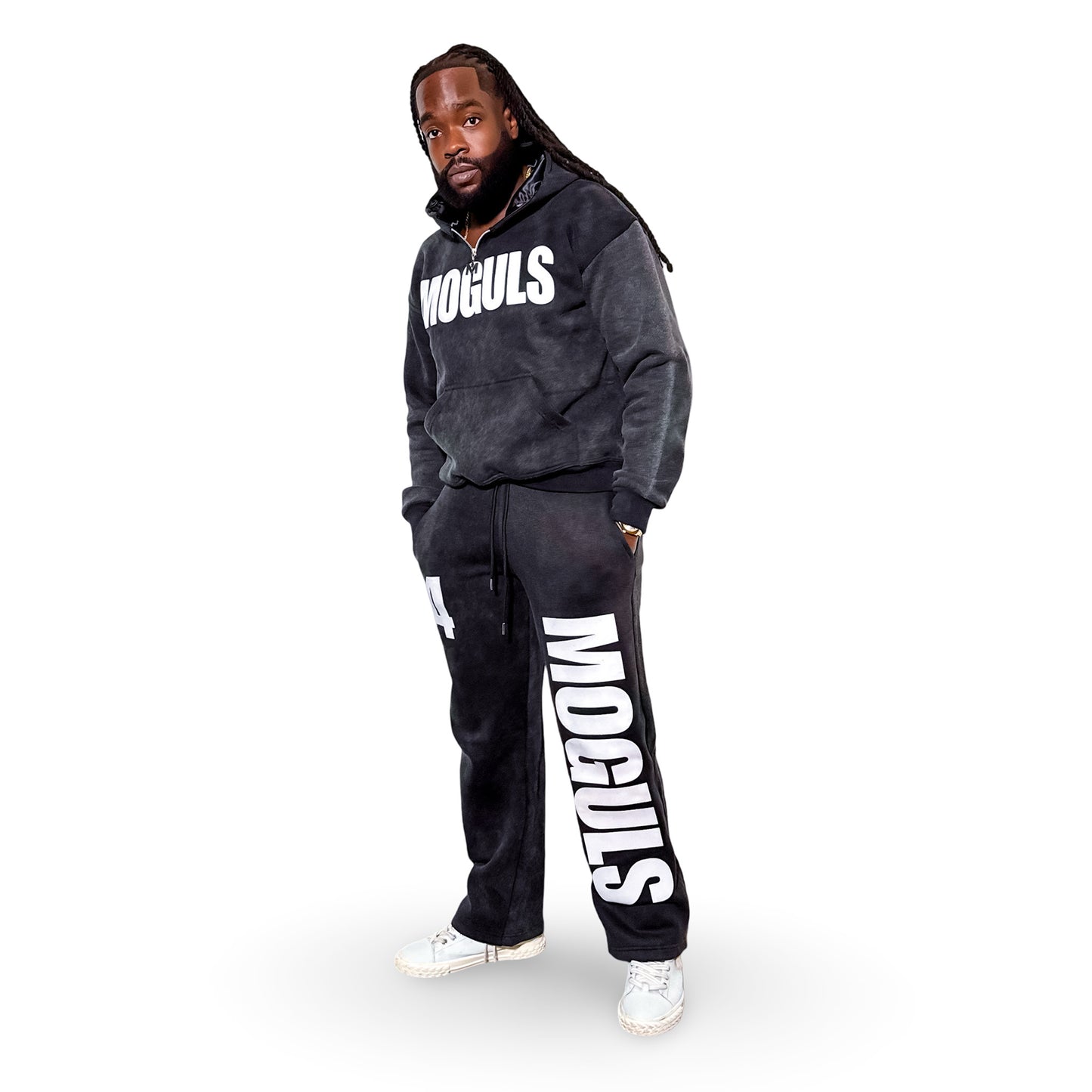 Model wearing the 4 Moguls Oversized Sweatsuit in black with MOGULS logo on chest and bold leg branding