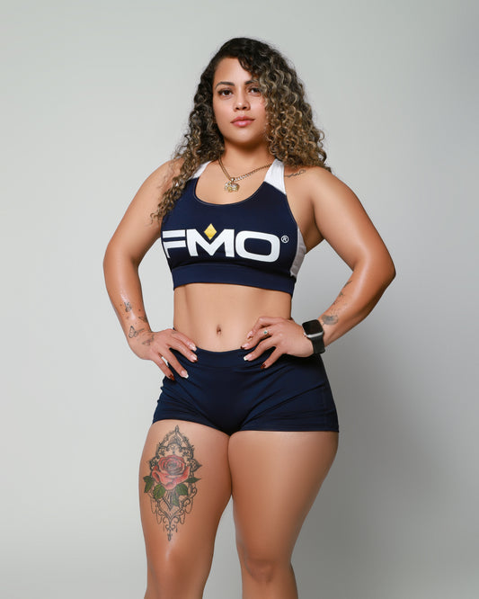 Elite Level Coaching by For Moguls Only featuring female athlete in FMO performance apparel. Advanced fitness coaching, personalized training, nutrition strategy, accountability, and high-performance lifestyle support.