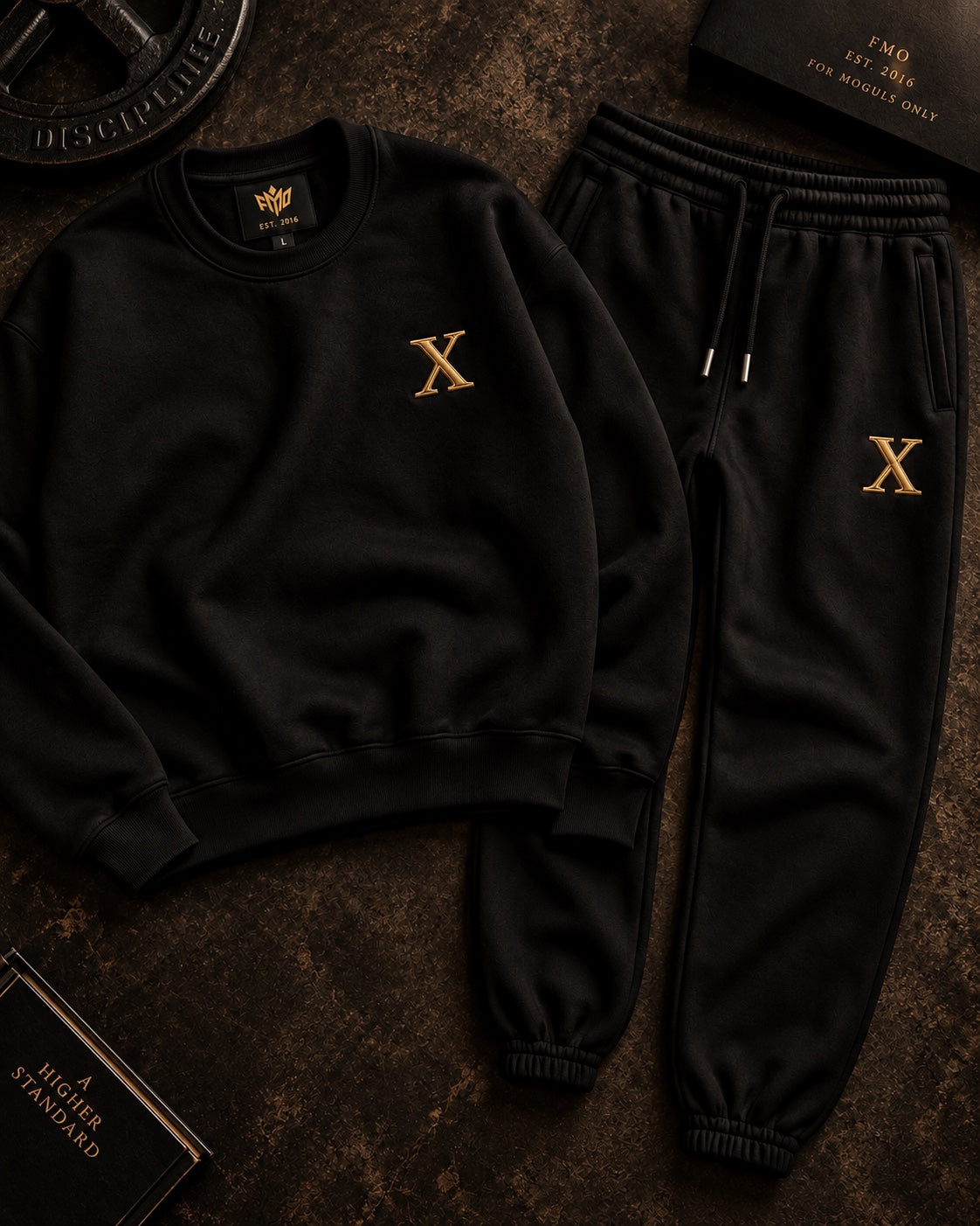 House of Drip Anniversary Uniform flat lay with black crewneck and matching joggers.