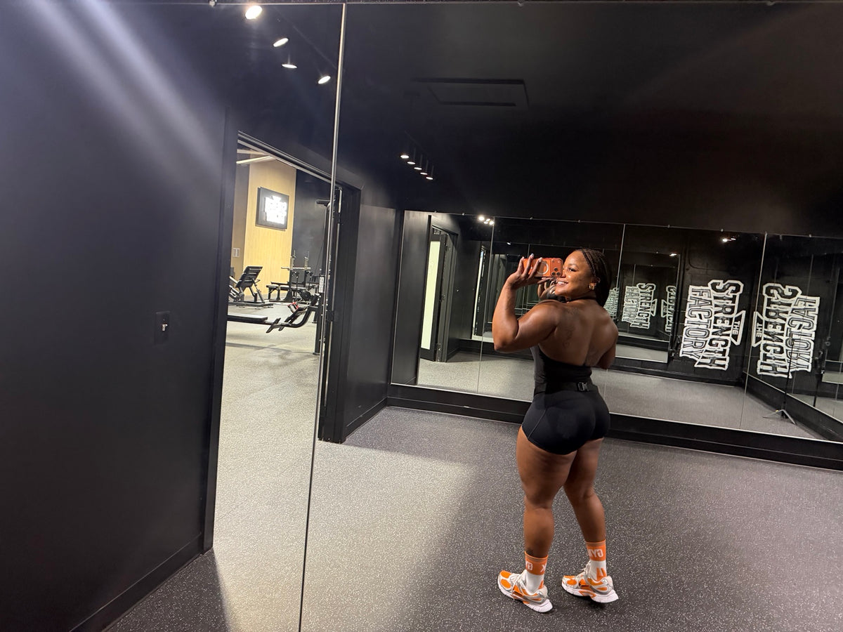 Rear fit of the black Pressure Short during a gym workout