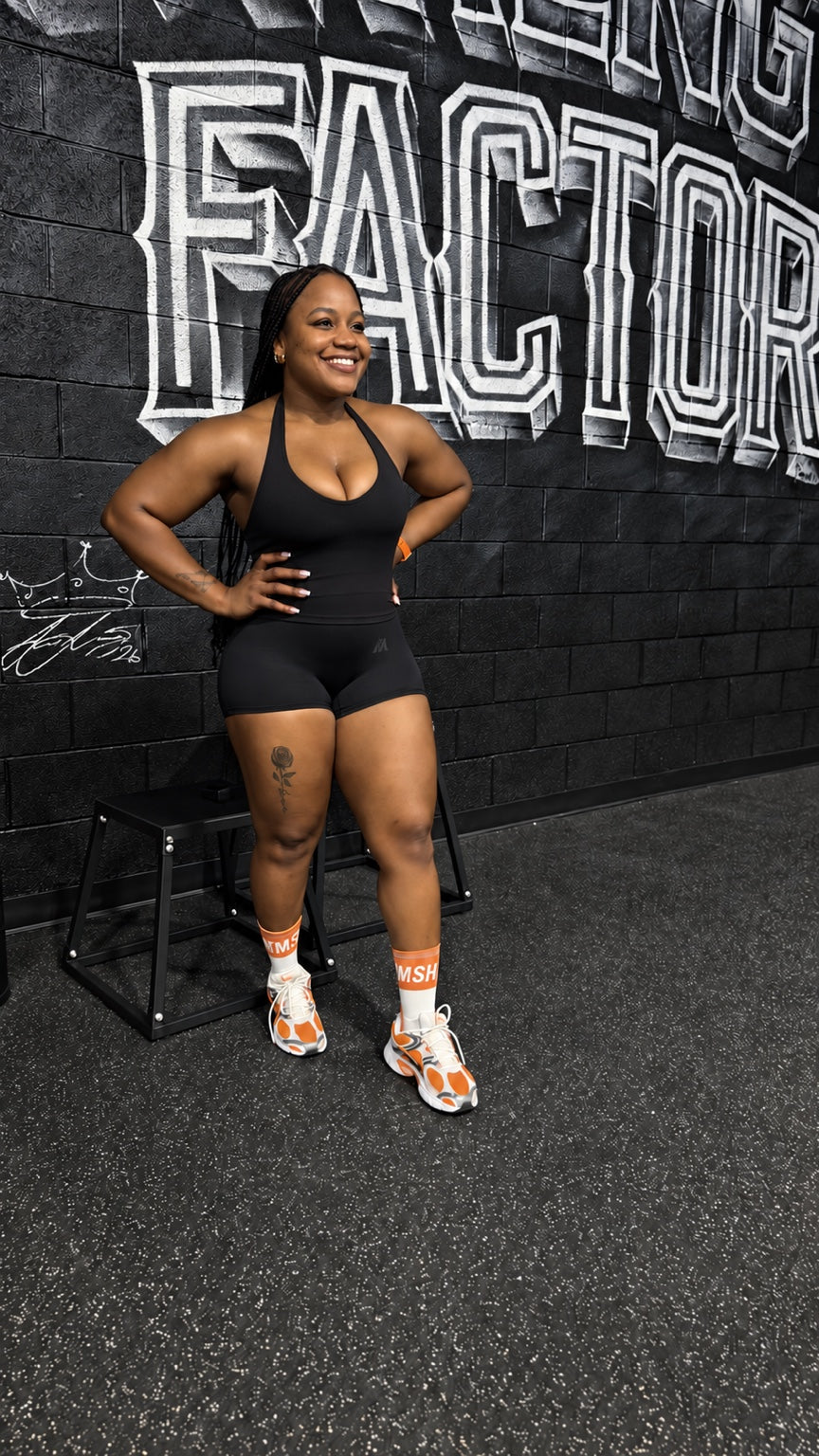 Full-body fit of the black Quiet Bra and Pressure Short in the gym